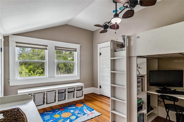 bedroom with vaulted ceiling, ceiling fan, and hardwood / wood-style flooring