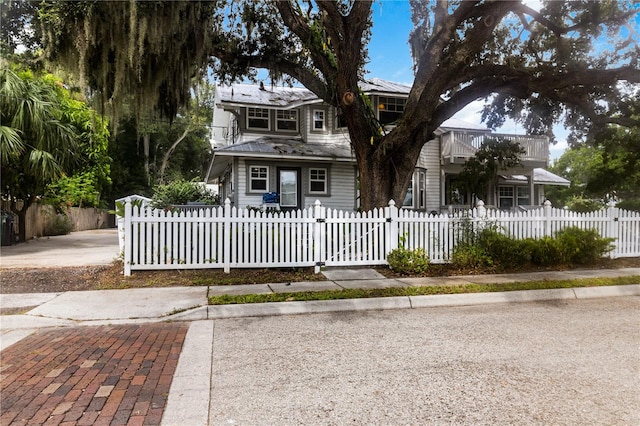 view of front of house with a balcony