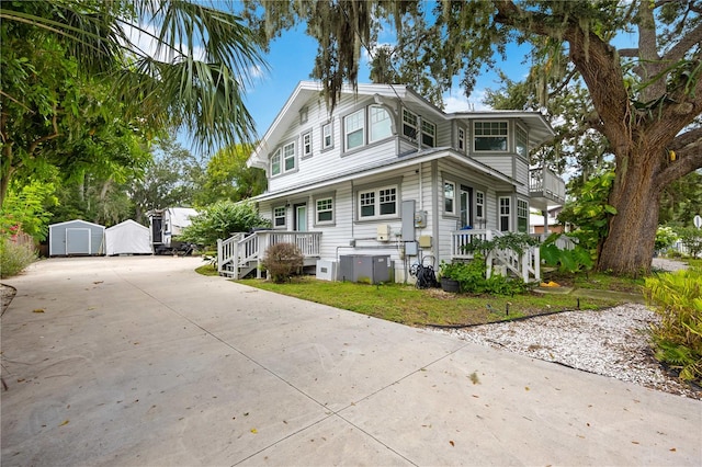 view of front of house featuring a storage shed