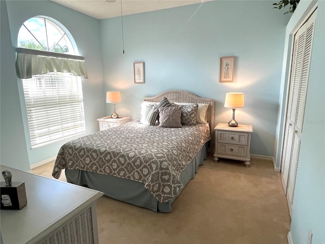 carpeted bedroom with a closet