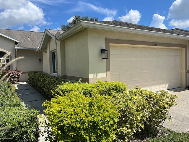 view of side of property with a garage