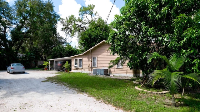 1820 7th Ave E, Bradenton, FL 34208 - view of property exterior featuring dirt driveway and central AC