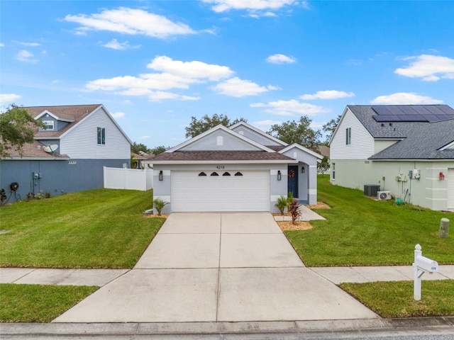 view of front of house with a garage and a front lawn