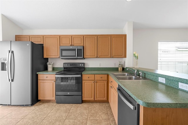 kitchen featuring kitchen peninsula, light tile patterned flooring, sink, and stainless steel appliances