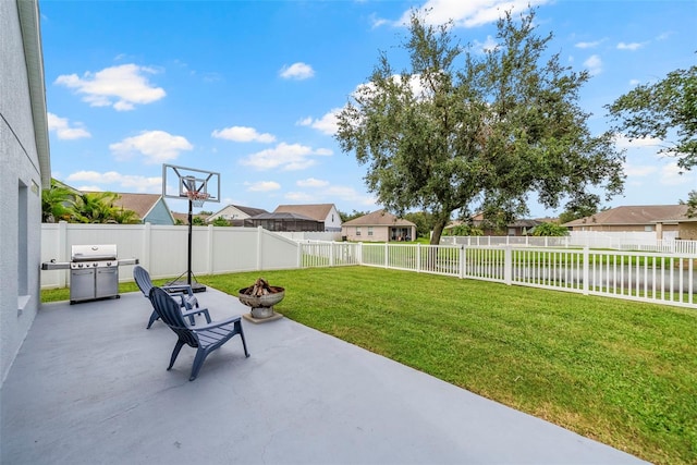 view of patio / terrace featuring area for grilling and a fire pit