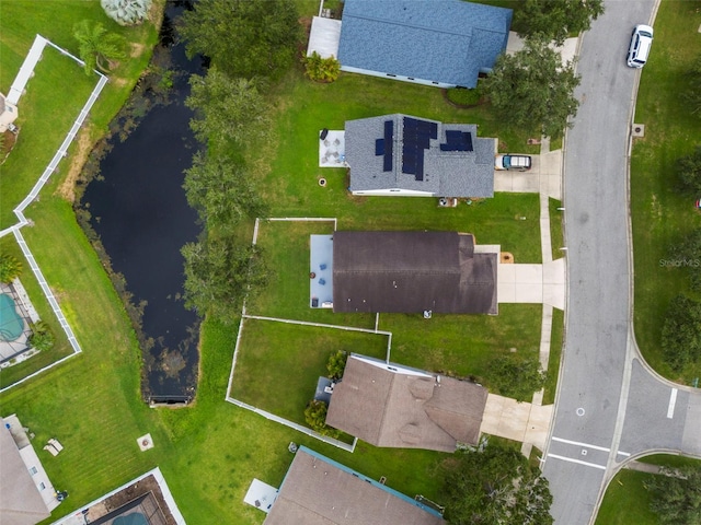 drone / aerial view with a water view