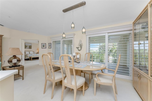 view of carpeted dining area