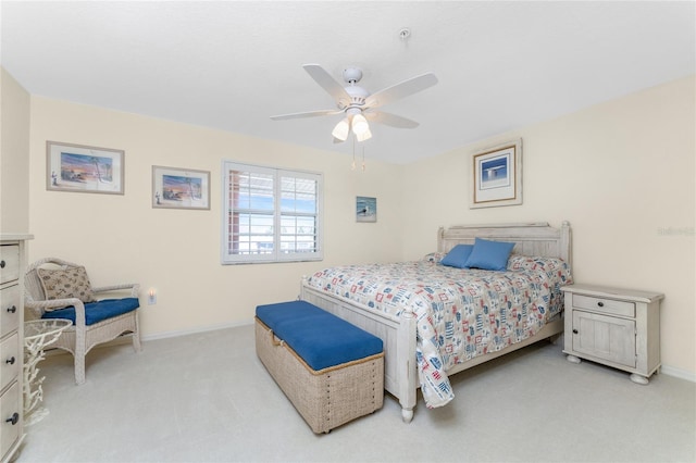 bedroom with light carpet and ceiling fan