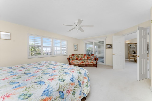 bedroom with ceiling fan and light colored carpet