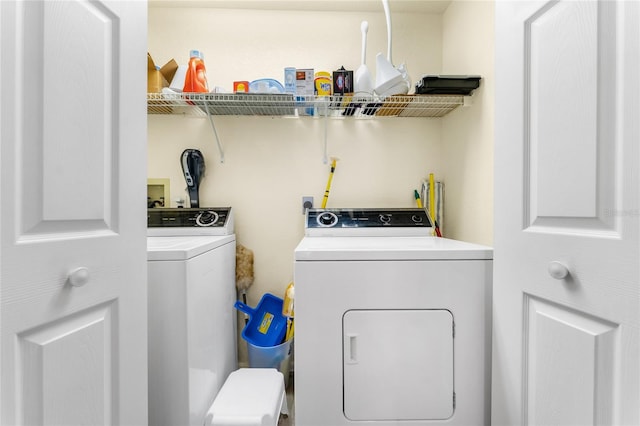 laundry room with washing machine and dryer