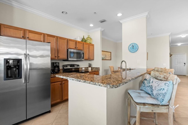 kitchen featuring sink, appliances with stainless steel finishes, light tile patterned floors, crown molding, and dark stone countertops