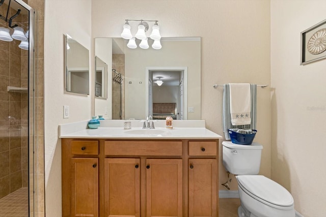 bathroom with walk in shower, vanity, toilet, and tile patterned floors