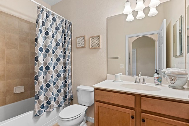 full bathroom with shower / bath combo, vanity, and toilet