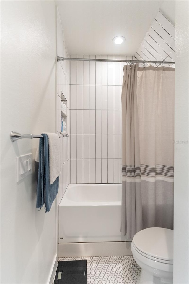 bathroom with shower / bath combo, toilet, and tile patterned floors