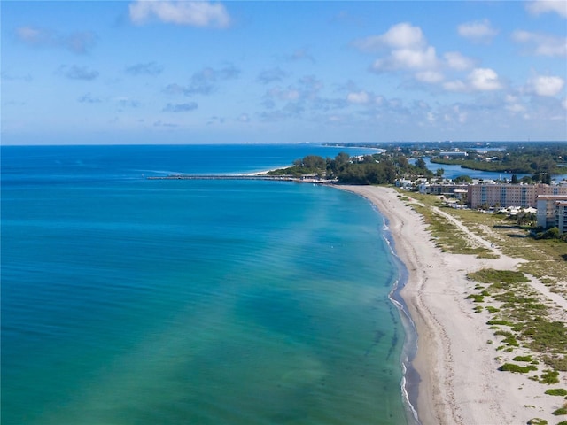 birds eye view of property featuring a view of the beach and a water view