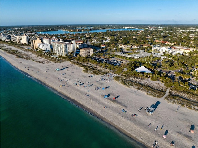 birds eye view of property featuring a water view and a view of the beach