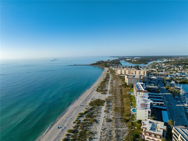 birds eye view of property with a view of the beach and a water view