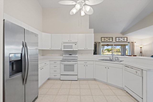 kitchen featuring ceiling fan, sink, white appliances, and white cabinetry