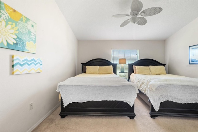 bedroom with light carpet and ceiling fan