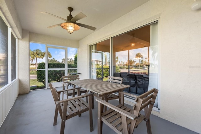 sunroom featuring ceiling fan