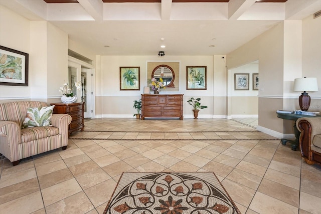 interior space featuring coffered ceiling and beamed ceiling