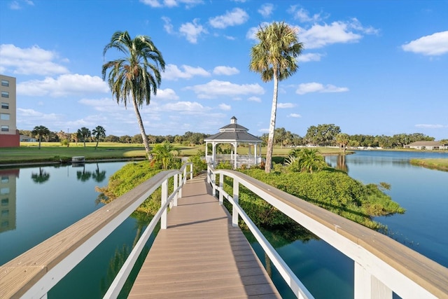 view of dock featuring a gazebo and a water view