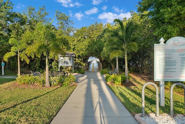 view of home's community featuring a lawn