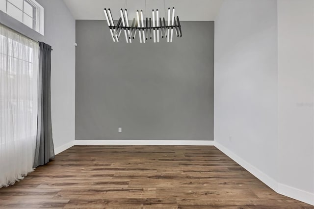 empty room featuring wood-type flooring