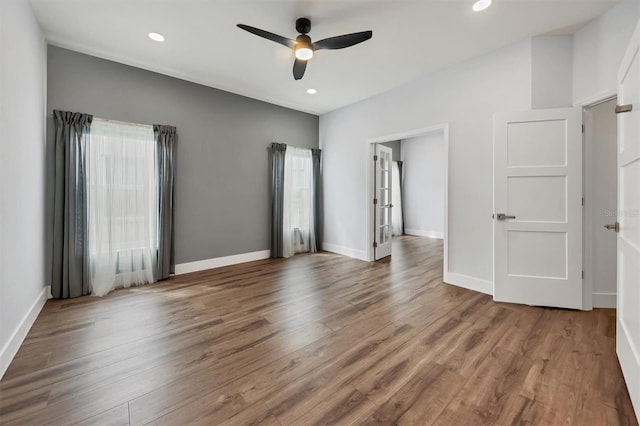 unfurnished bedroom featuring ceiling fan and hardwood / wood-style floors