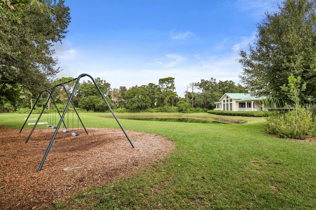 view of jungle gym featuring a lawn