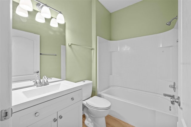 full bathroom featuring shower / tub combination, vanity, toilet, and wood-type flooring