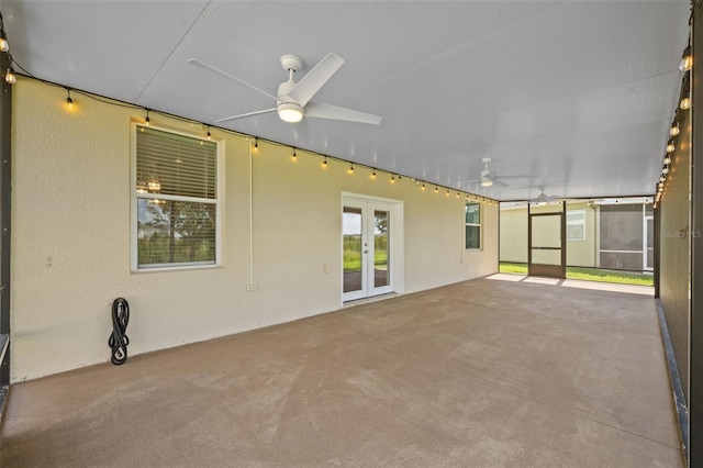 exterior space with ceiling fan, french doors, and a patio area