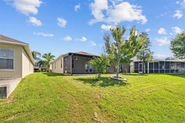 view of yard featuring a sunroom