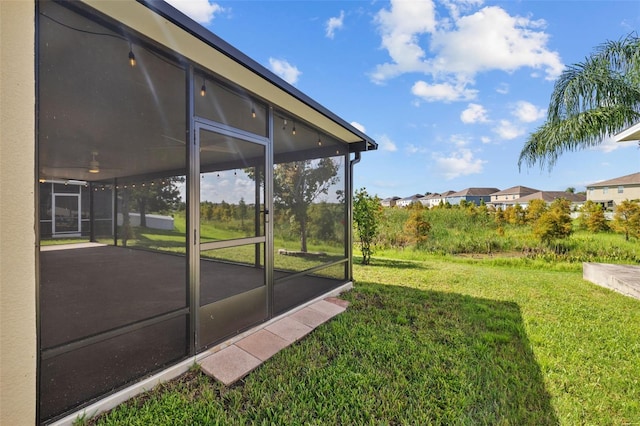 view of yard with a sunroom