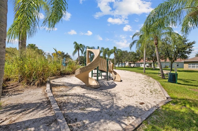 view of playground with a lawn