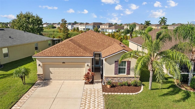 view of front facade featuring a front yard and a garage