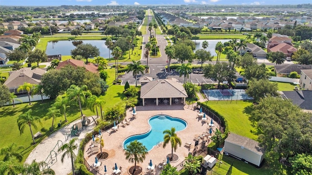 birds eye view of property with a water view