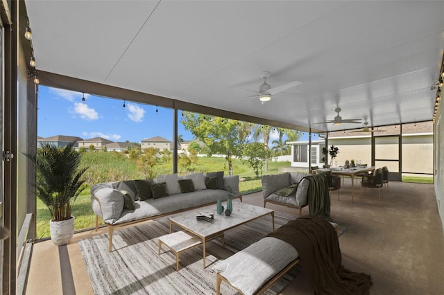 sunroom / solarium featuring ceiling fan and a healthy amount of sunlight