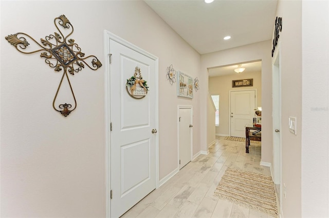 hall with light hardwood / wood-style floors