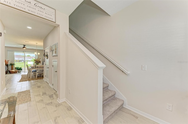 stairway featuring wood-type flooring