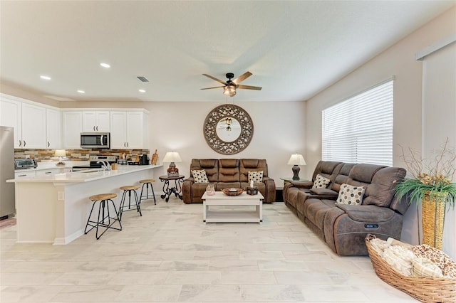 living room featuring ceiling fan