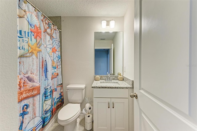 bathroom with a textured ceiling, vanity, toilet, and a shower with shower curtain