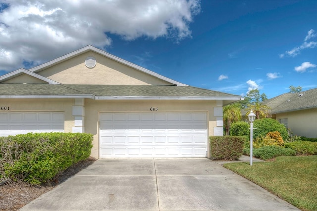 view of front of property with a garage