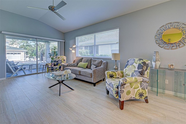 living room with ceiling fan and vaulted ceiling