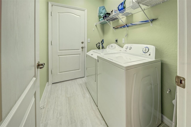 washroom with separate washer and dryer