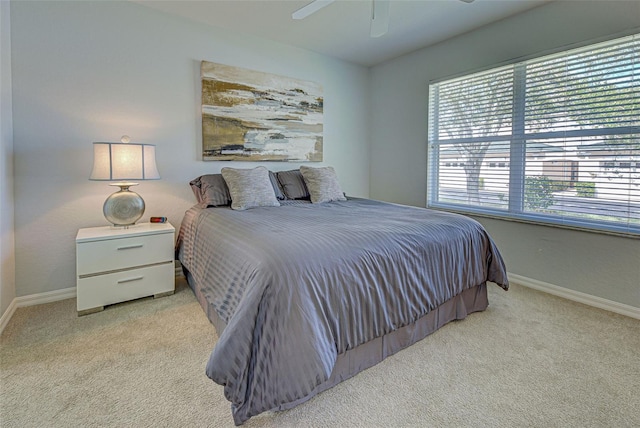 bedroom with light colored carpet and ceiling fan