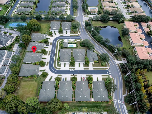 birds eye view of property with a water view