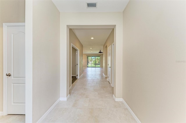 hallway featuring light tile patterned floors