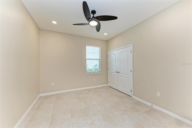 unfurnished bedroom featuring light tile patterned floors, a closet, and ceiling fan