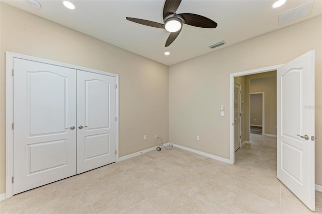 unfurnished bedroom featuring a closet and ceiling fan